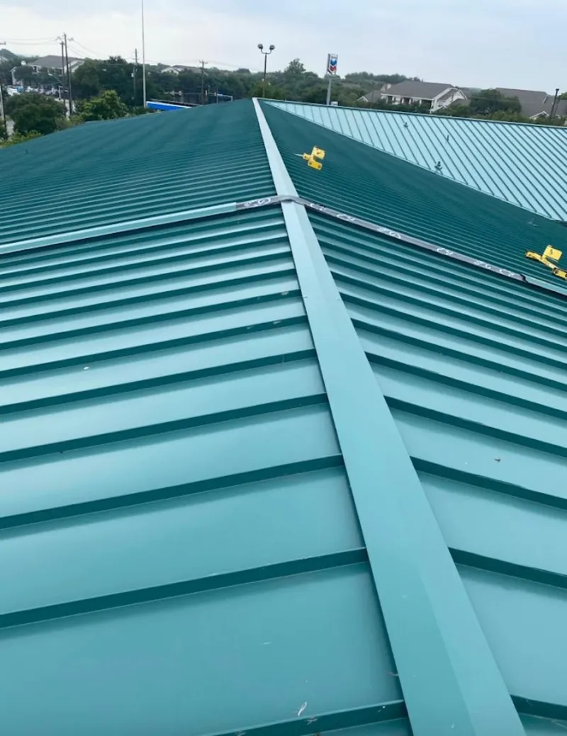 Green commercial metal roof ridge and valley for Metal Roof Repair in Forest Lake